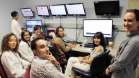 Doctors and child neurology residents sitting in front of computers